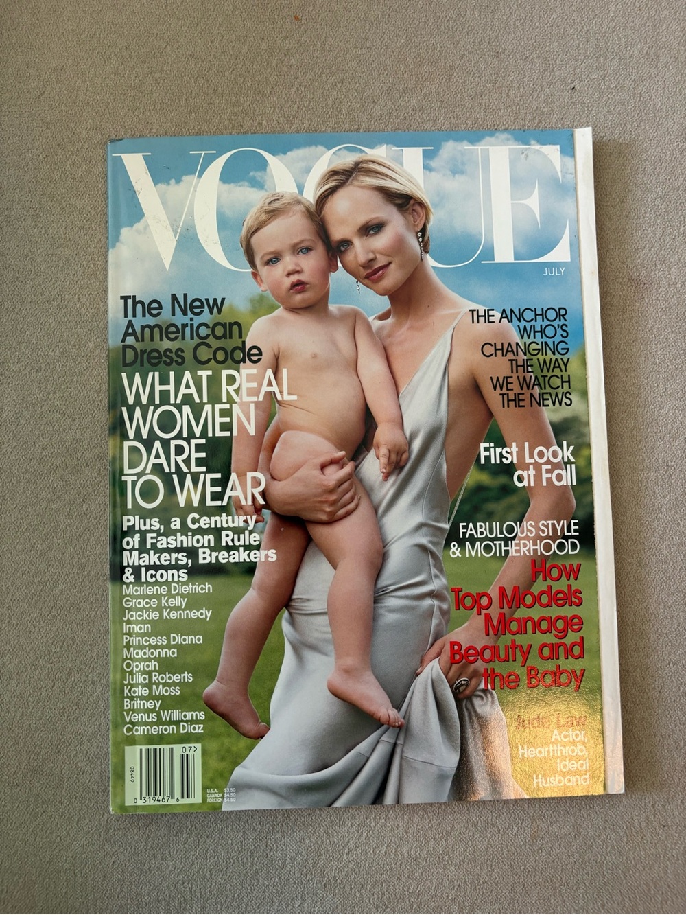 Vogue Magazine featuring Amber Valletta (photographed holding her son) July 2002